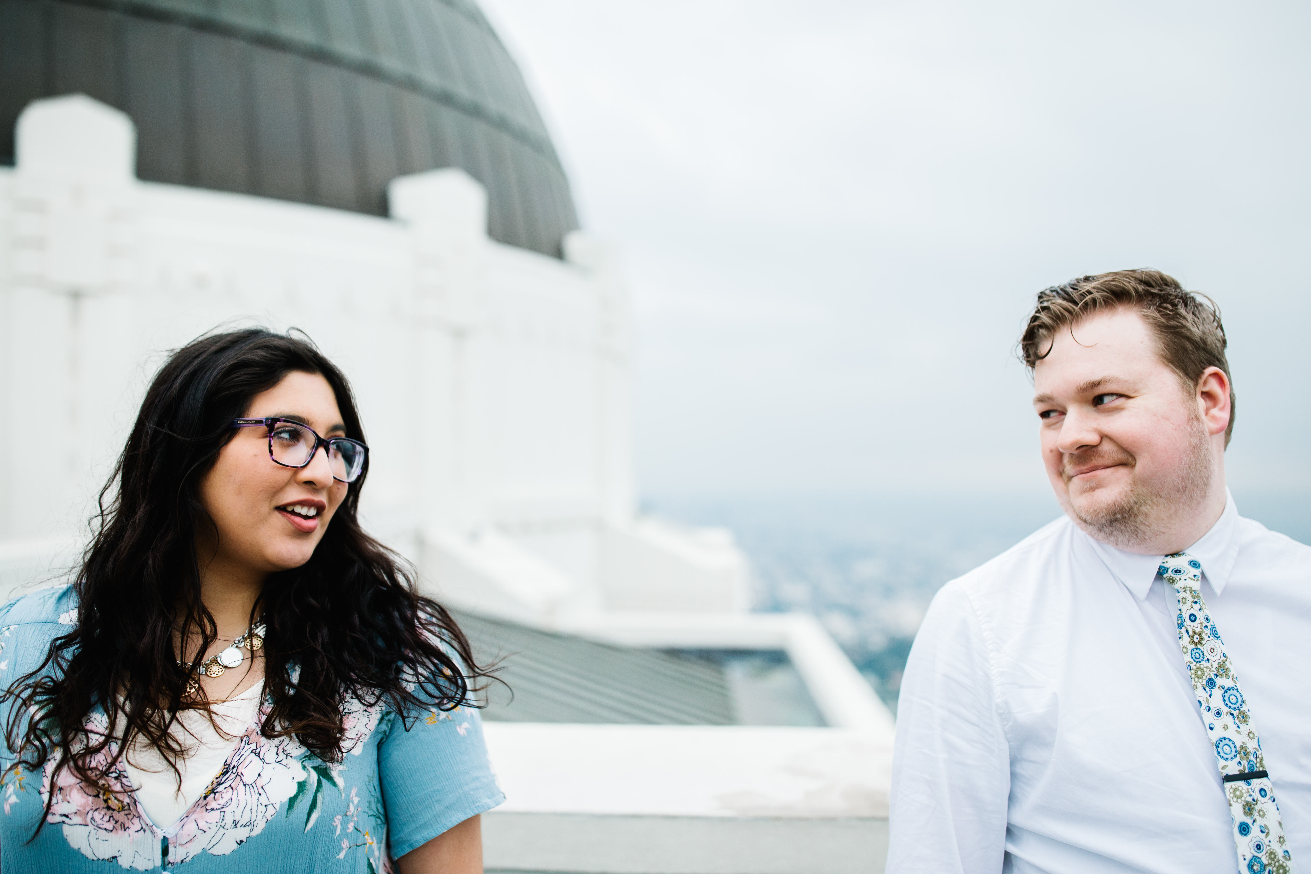 griffith observatory engagement photos Couple looking at each other at Griffith Observatory in Los Angeles , California.