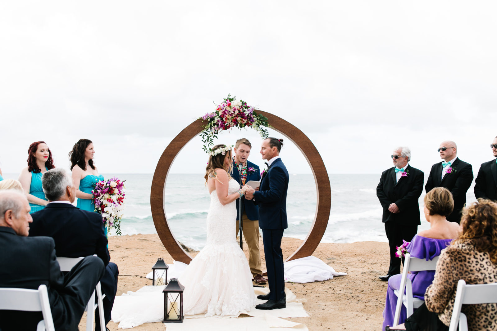 couple standing at the altar on ocean cliff at sunset cliffs wedding