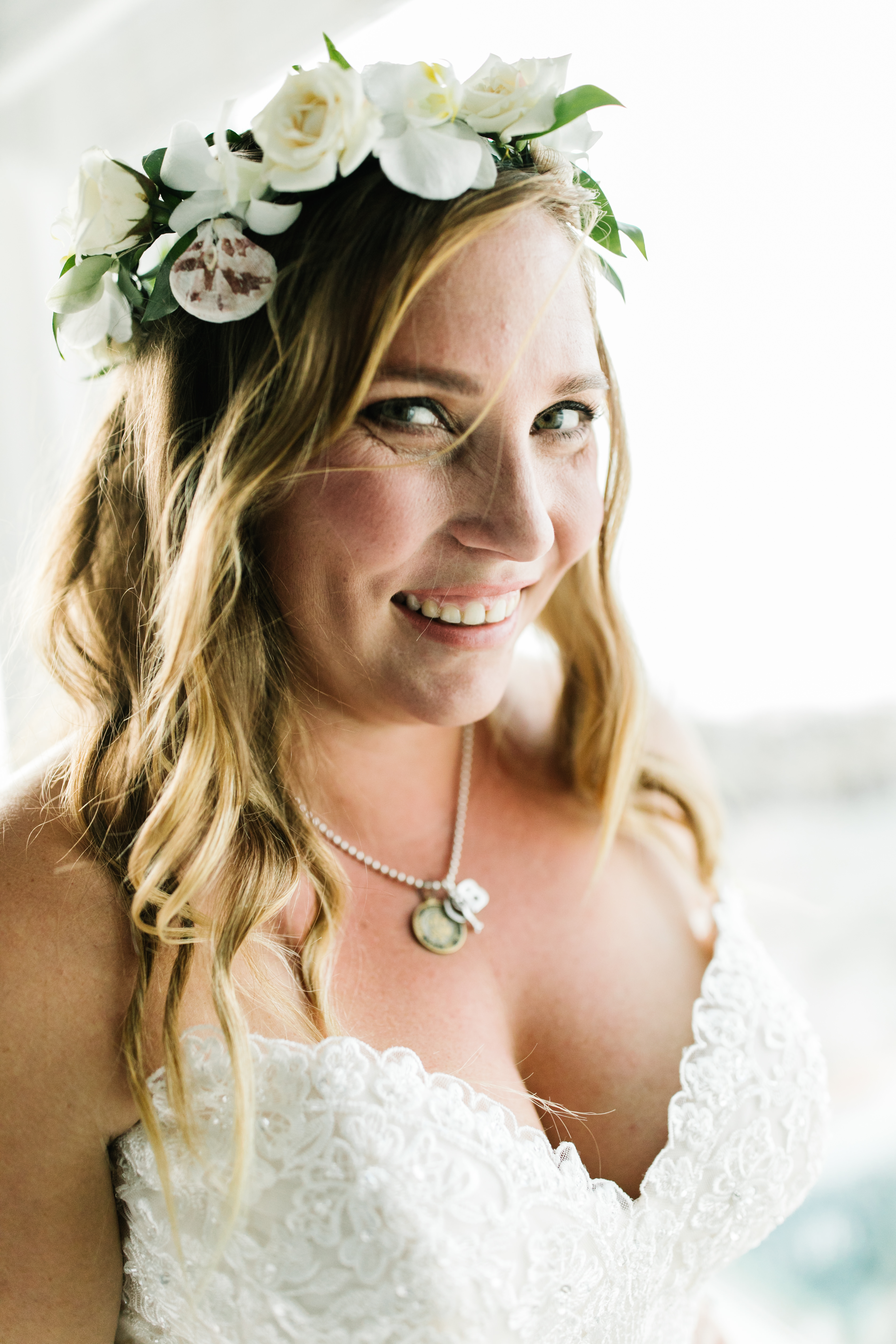 bride smiling with flower crown sunset cliffs wedding