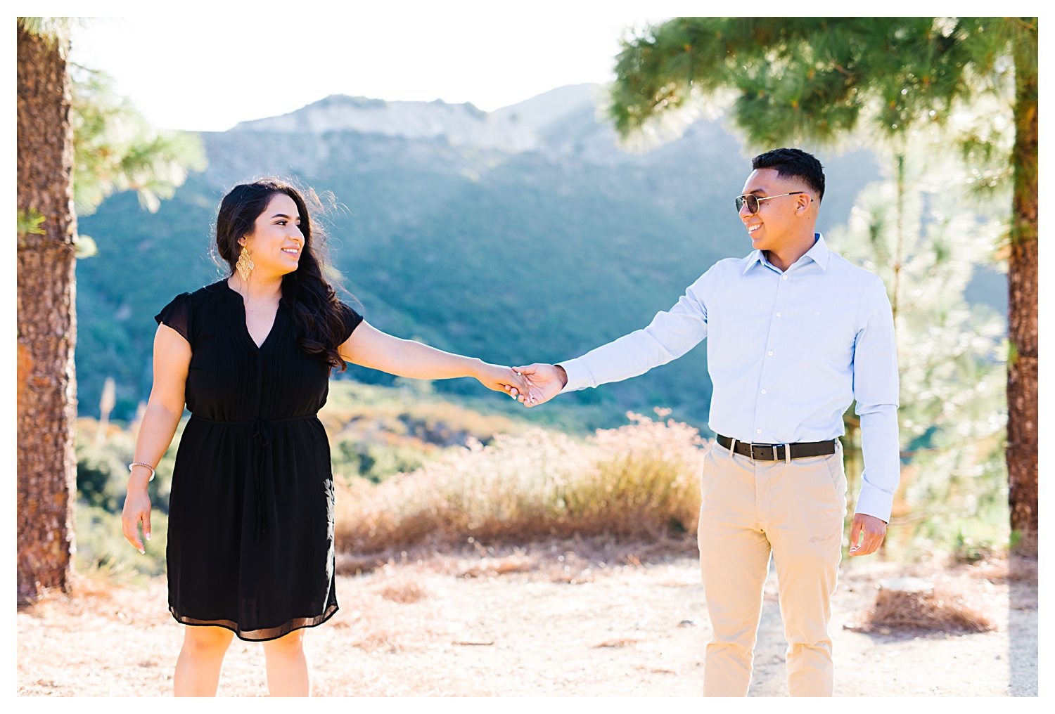 Angeles National Forest Engagement Photos couple holding hands and looking at each other in forest