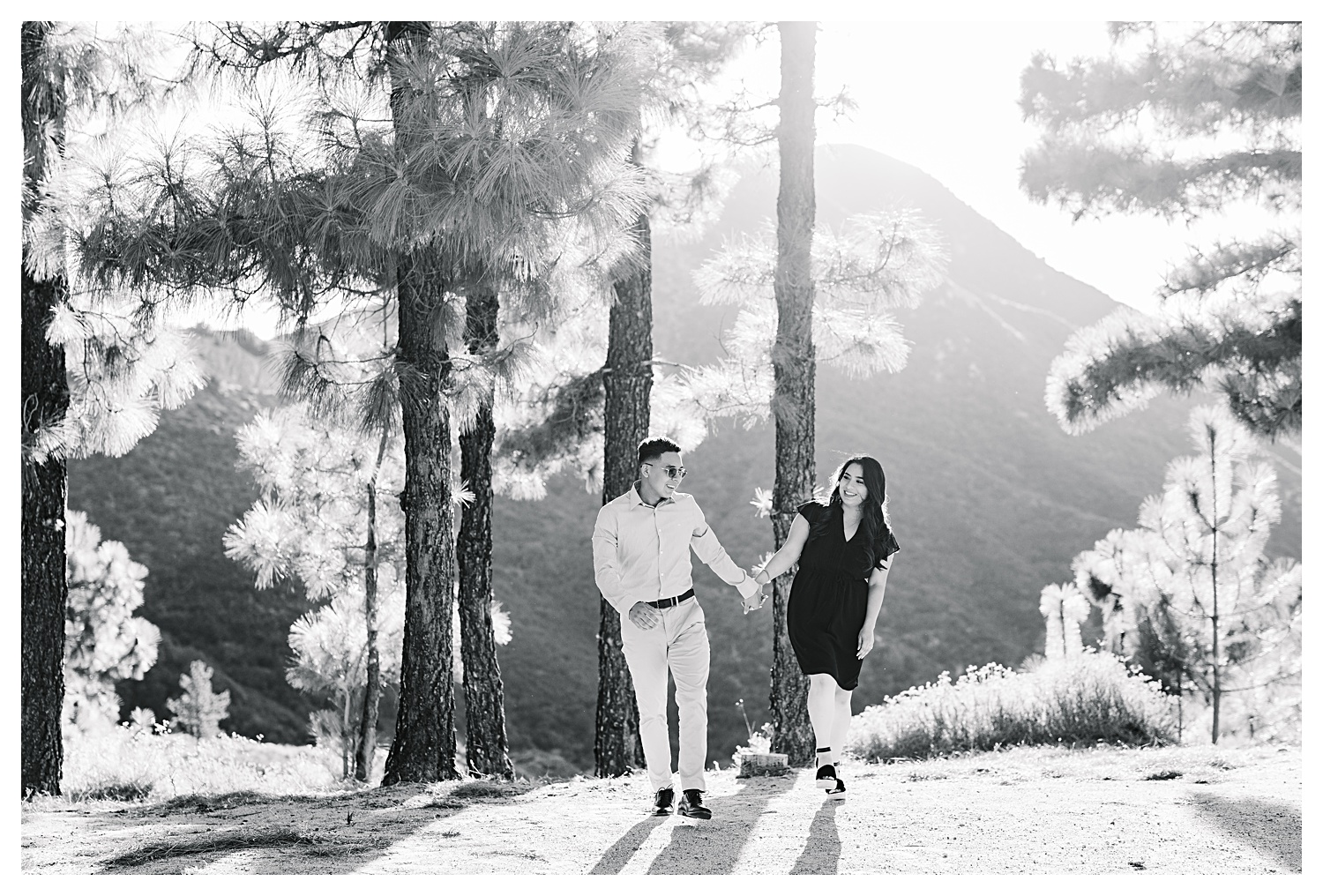 Angeles National Forest Engagement Photos couple walking together with mountain view