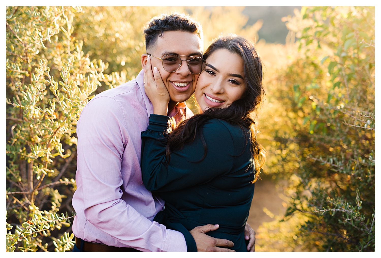 Angeles National Forest Engagement Photos faces snuggled up in forest during golden hour