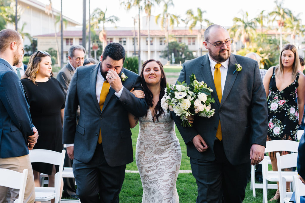 bride walked down the aisle by her brothers