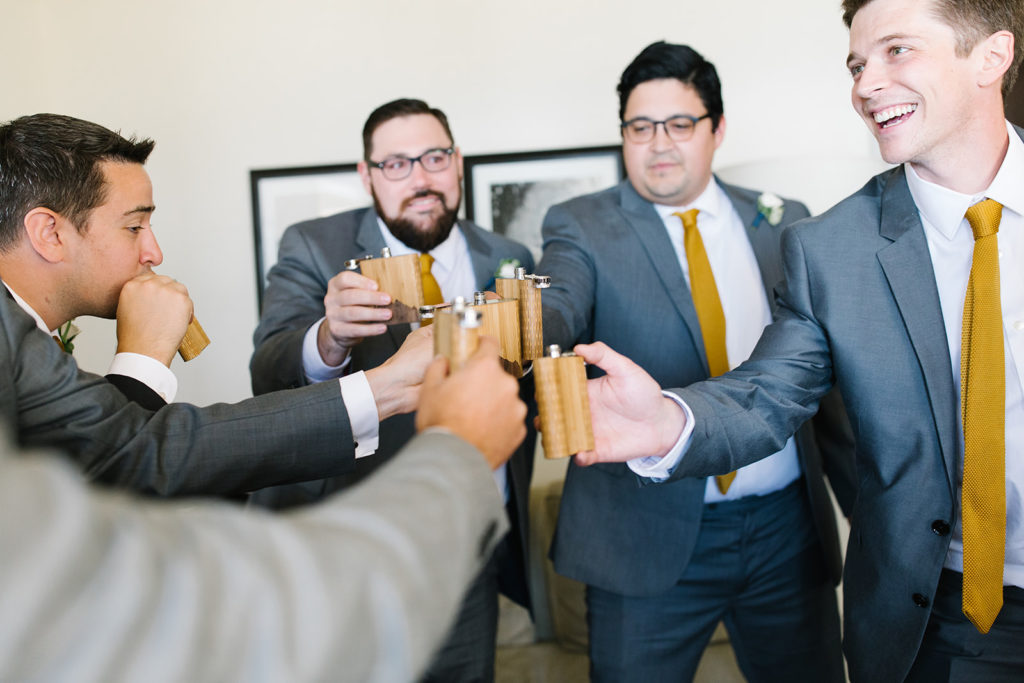 groomsmen cheering flask gifts wedding