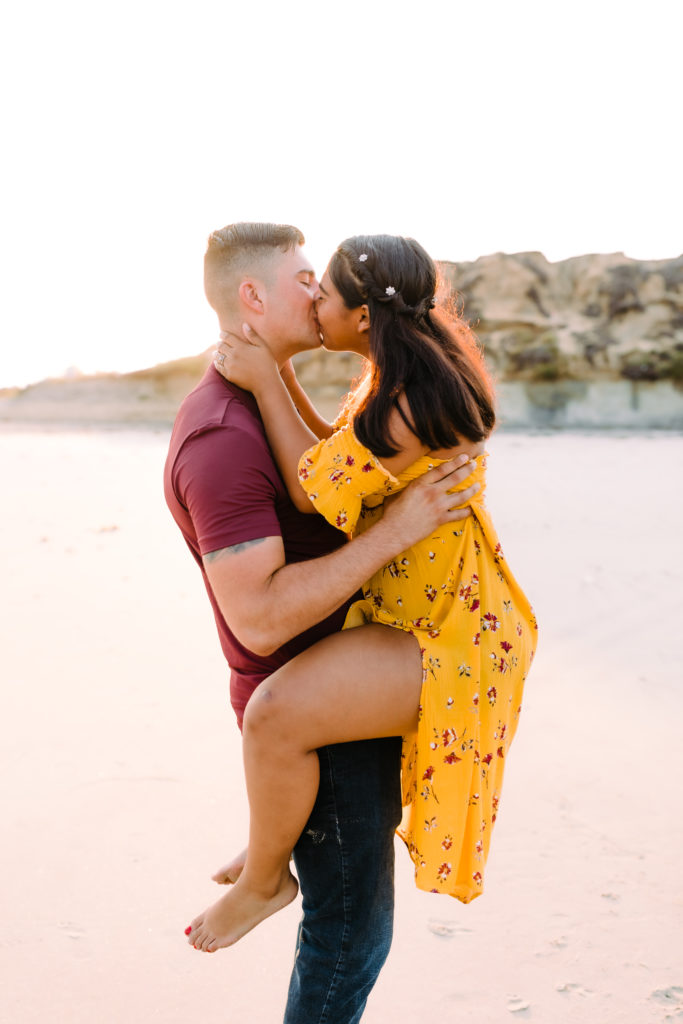 notebook style kiss on beach during sunrise